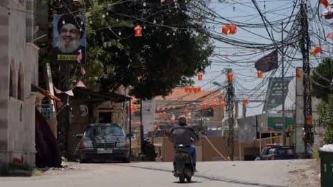 A man rides a motorcycle in Arab Salim, a village in southern Lebanon