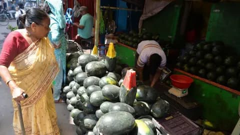 A roadside temporary seller offers summer fruit watermelons from their shop at a market area in Siliguri, India, on May 5, 2026. (Photo by Diptendu Dutta/NurPhoto via Getty Images)