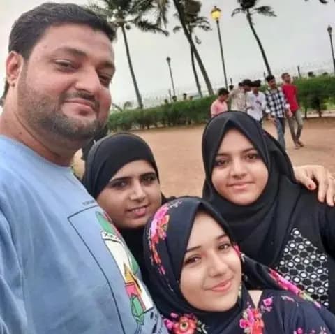 Dokadia family in happier times - Abdullah and wife Nasreen with their two daughters Ayesha and Zainab