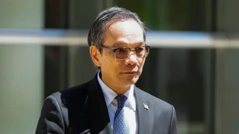 Lu Jianwang, a US citizen convicted with conspiring to act as an agent of the Chinese government, exits Brooklyn Federal court during his trial in New York City on 12 May 2026. 
